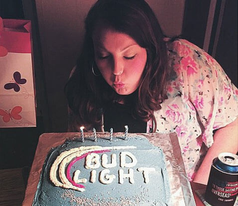 Bud Light brand ambassador with her branded cake